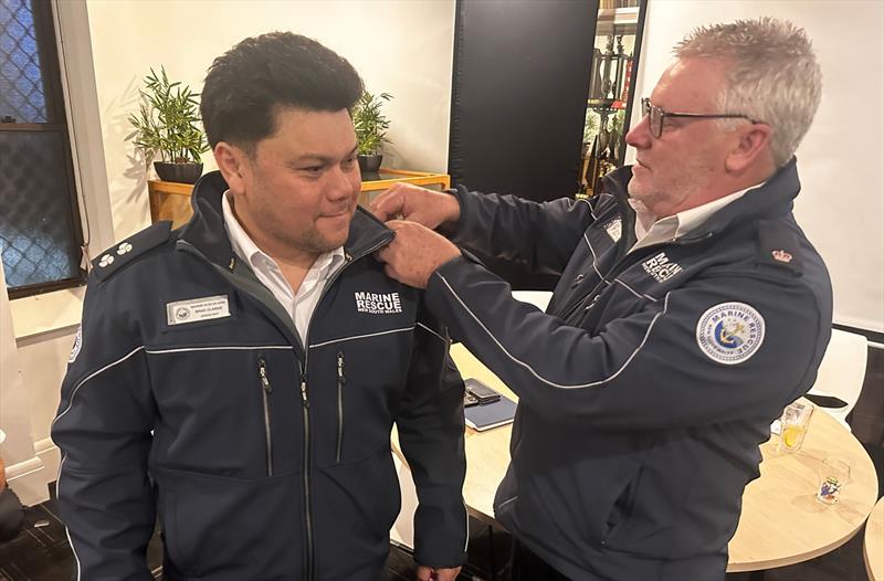 Newly elected Marine Rescue Jervis Bay Unit Commander Brad Clarke recieves his epaulettes from Inspector Stuart Massey photo copyright Marine Rescue NSW taken at  and featuring the Marine Industry class