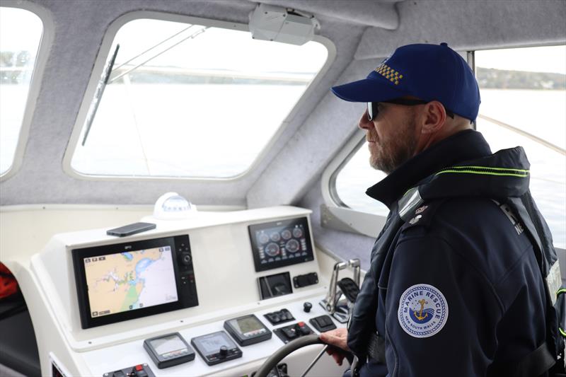 Marine Rescue NSW Fleet Manager Kelvin Parkin on the helm of ED 30 photo copyright Marine Rescue NSW taken at  and featuring the Marine Industry class