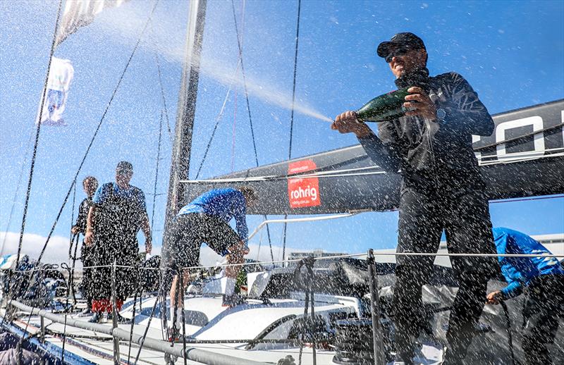 Mark Bradford sprays the champagne onto Wild Oats XI - photo © Crosbie Lorimer