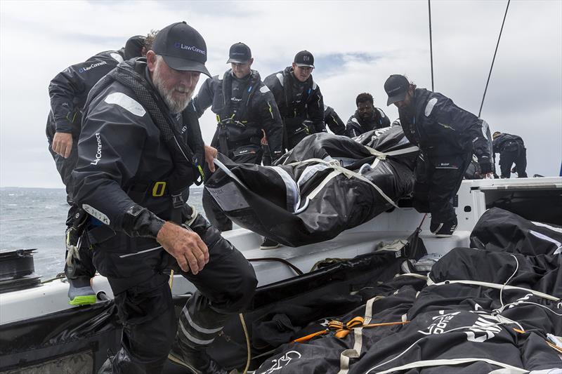 Sail Management for LawConnect now includes sending the heavy sails down below photo copyright Andrea Francolini taken at Cruising Yacht Club of Australia and featuring the Maxi class