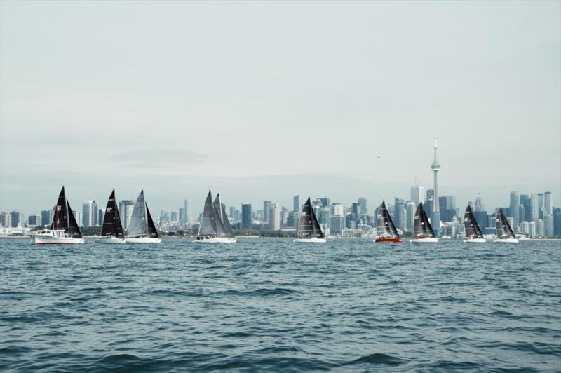 Melges 24 fleet racing in front of the Toronto skyline at the Canadian National Championship 2022 photo copyright Alina Heinrich taken at National Yacht Club, Canada and featuring the Melges 24 class