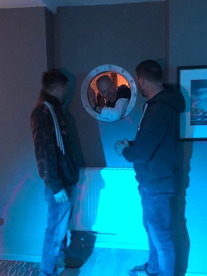 Birthday Boy Richard goes through the Porthole during the Hollingworth Lake Sailing Club Felucca Trophy photo copyright Peter Bramwell taken at Hollingworth Lake Sailing Club and featuring the Merlin Rocket class