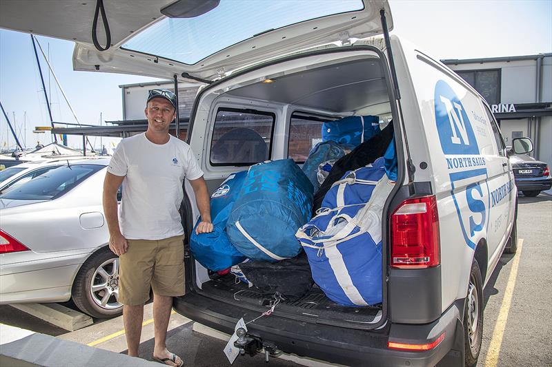 Billy Sykes unloading some of the 100 new or serviced sails that North Sails have to deliver in the week just past photo copyright John Curnow taken at Cruising Yacht Club of Australia