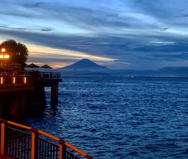 Mount Fuji rises in the distance. In the foreground is the 2020 Summer Olympics sailing venue in Enoshima, Japan photo copyright Perfect Vision Sailing taken at 