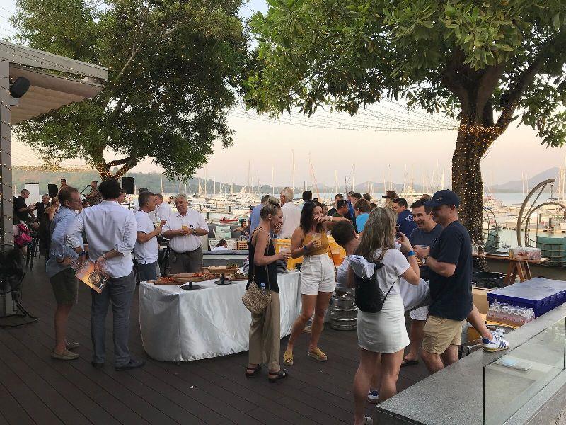 The networking party in full swing at sunset looking over Phuket Yacht Haven Marina photo copyright AIMEX taken at 