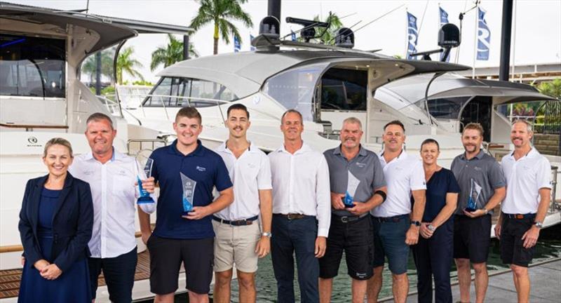 The R Marine Jones team, headed by Randall and Melinda Jones (far left), celebrates with Riviera owner Rodney Longhurst (pictured centre) after being honoured with four awards, including Australasian Dealership of the Year, in 2021 photo copyright Riviera Australia taken at 