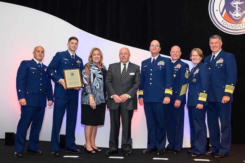 Second Class Boatswain's Mate David Reynolds, Coast Guard Chief Aviation Survival Technician Kevin Cleary (left) accepts an award from Coast Guard Foundation President Susan Ludwig and Chairman Tom Allegretti. - photo © Steven David Johnson