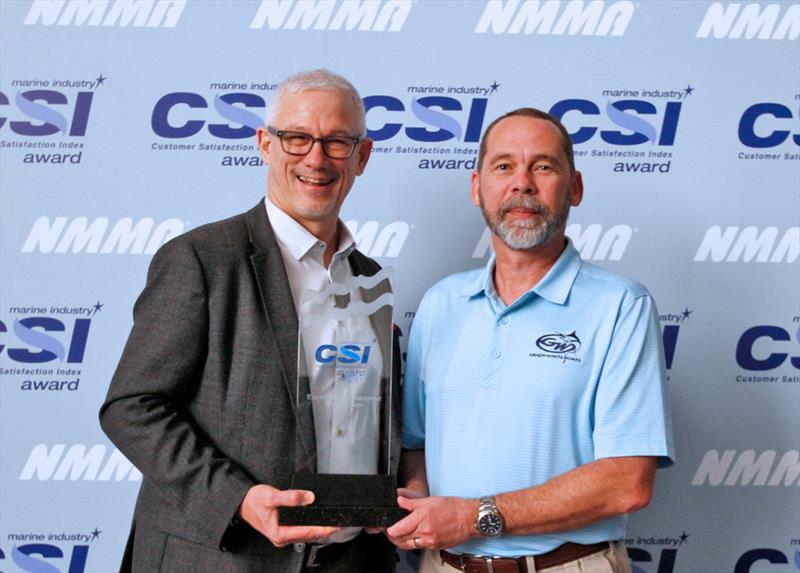 L-R: National Marine Manufacturers Association President, Frank Hugelmeyer, presents Todd Leggett, Grady-White Boats Dealer/Customer Relations Manager, with the 2021 NMMA Marine Industry Customer Satisfaction Index Award at the Miami Boat Show - photo © Grady-White