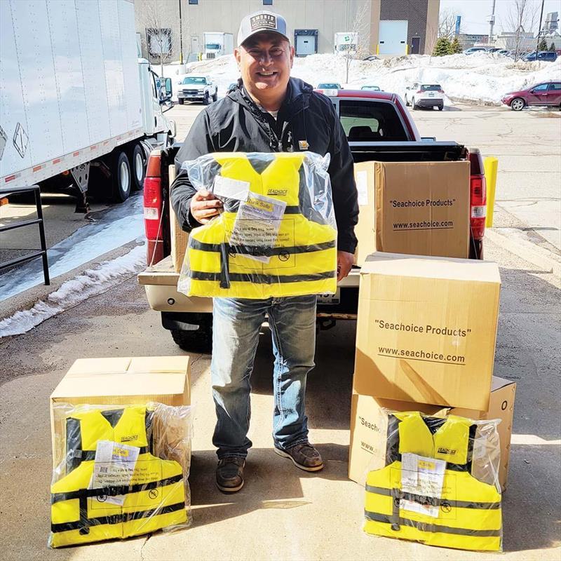 Bart Shanks from Hub's Yacht Club and Marina in Minnesota with donated SeaChoice life jackets photo copyright Sea Tow Foundation taken at 