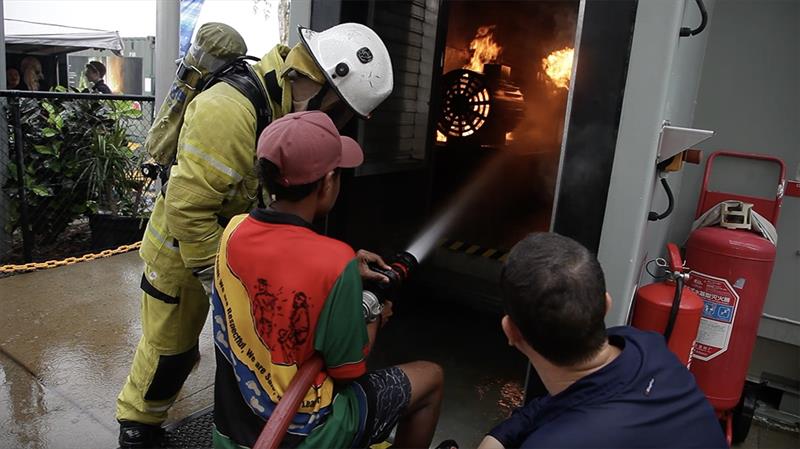 Attendees experiencing the fire simulation on campus at the Great Barrier Reef International Marine College - Cairns Maritime Careers Open Day - photo © Nicholas Thorowgood