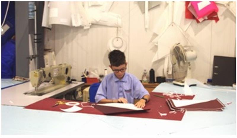 Mason at work, sticking corner patches ready for sewing.... photo copyright jeckells.co.uk taken at 