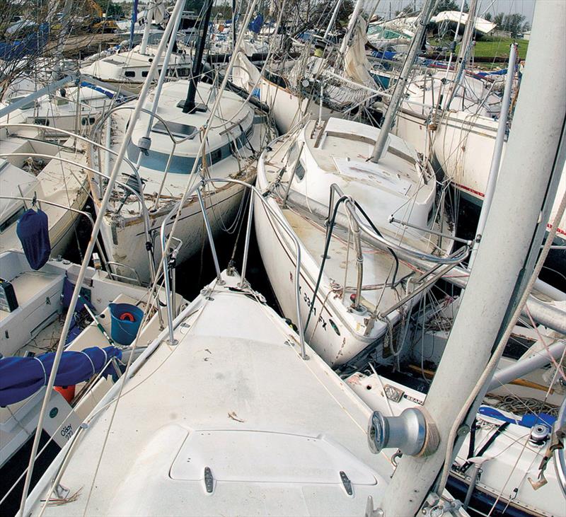 Pile of heavily damaged fiberglass boats at Pleasure Island Marina in Port Arthur, Texas - photo © RCA Engineering