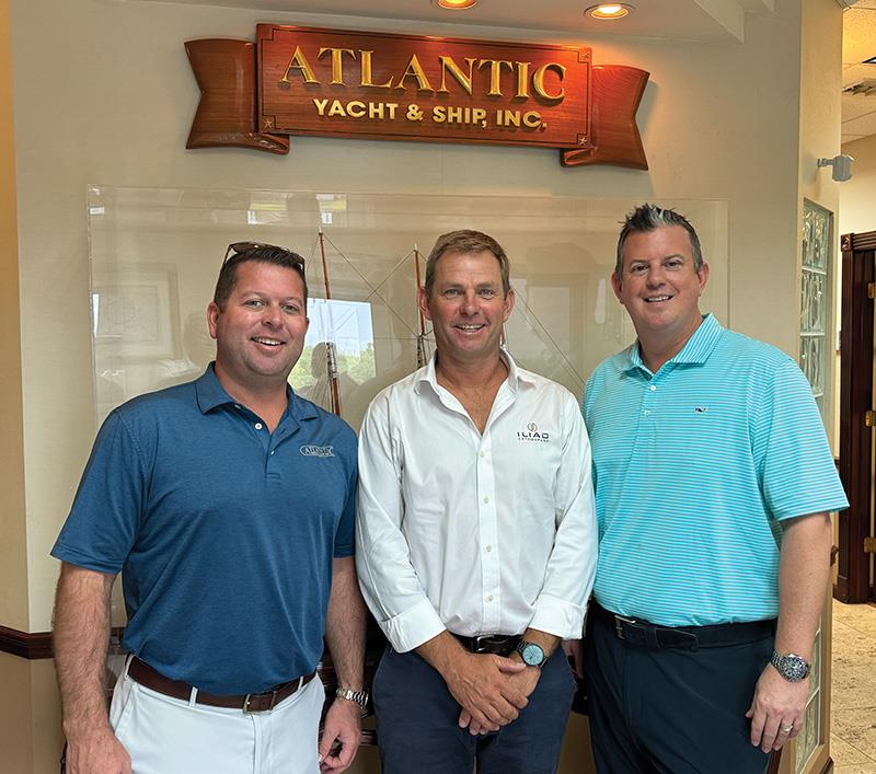 ILIAD Catamarans general manager Michael ‘Nod’ Crook (centre) celebrates the new dealership announcement with Atlantic Yacht & Ship, Inc.’s Chris Carroll (left) and David Huffman (right) - photo © ILIAD Catamarans