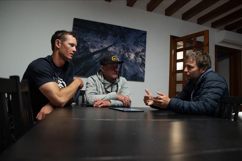 Erik Bowers (USST ILCA 6 Coach), Ryan Minth (USST ILCA 7 Coach), and Robby Bisi (USST Mixed 470 Coach) gather around the day's forecast photo copyright US Sailing Team taken at Real Club Náutico de Palma