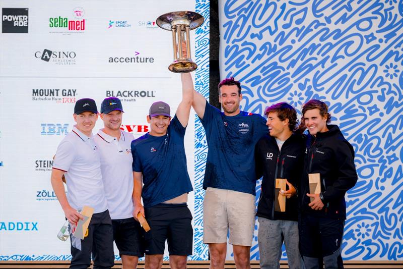 Beaming with joy at the top three of the Kieler Woche in the 49er from France (center), Germany (left) and Uruguay - photo © Sascha Klahn