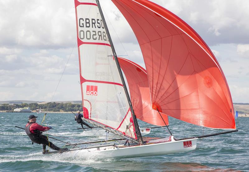 Musto Skiff racing in Portland Harbour photo copyright Tim Olin / www.olinphoto.co.uk taken at Castle Cove Sailing Club and featuring the Musto Skiff class