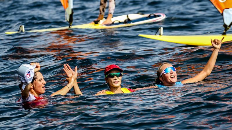 The three RS:X Womans Medal winners celebrate soon nafter the race finish - Tokyo2020 - Day 7- July, 31, - Enoshima, Japan. - photo © Richard Gladwell / Sail-World.com / nz