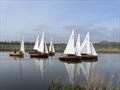 Wake over calm waters lasts for a long time, but proves progress during the Broads Area 2022 Champion-of-Champions Sailing Event © Ben Falat