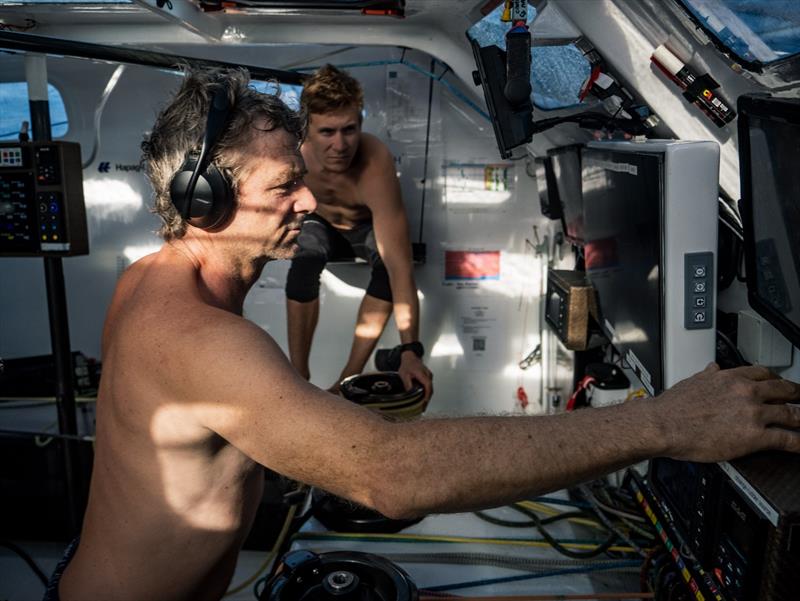 5 February 2023, Leg 2, Day 12 onboard Team Malizia. Yann Elies and Will Harris on the computer checking the foil loads as they are now sailing on a range of 25-33 knots photo copyright Antoine Auriol / Team Malizia taken at  and featuring the IMOCA class