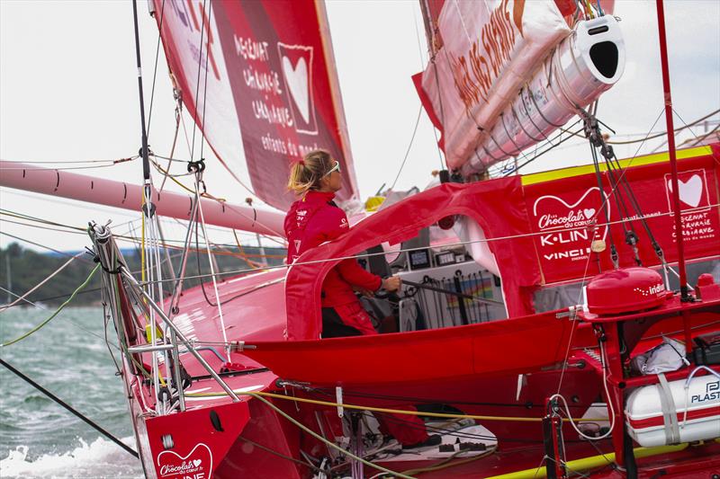 Sam Davies (GBR/FRA) helming her team's IMOCA at the start of the Rolex Fastnet Race - July 26, 2025 - Cowes - photo © Richard Gladwell - Sail-World.com/nz