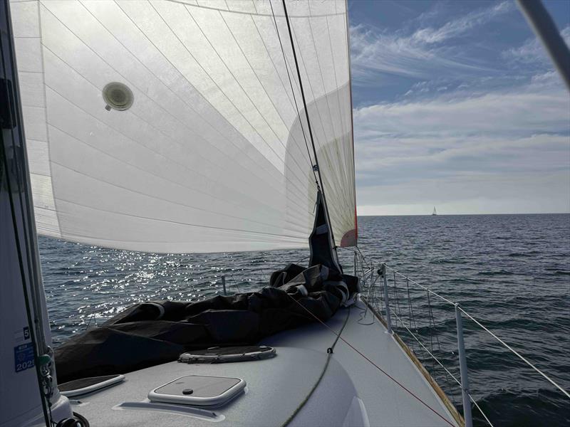 Full kites and smiling faces aboard Jonathan and Libby McKee's Riptide 44, Dark Star - photo © David Schmidt