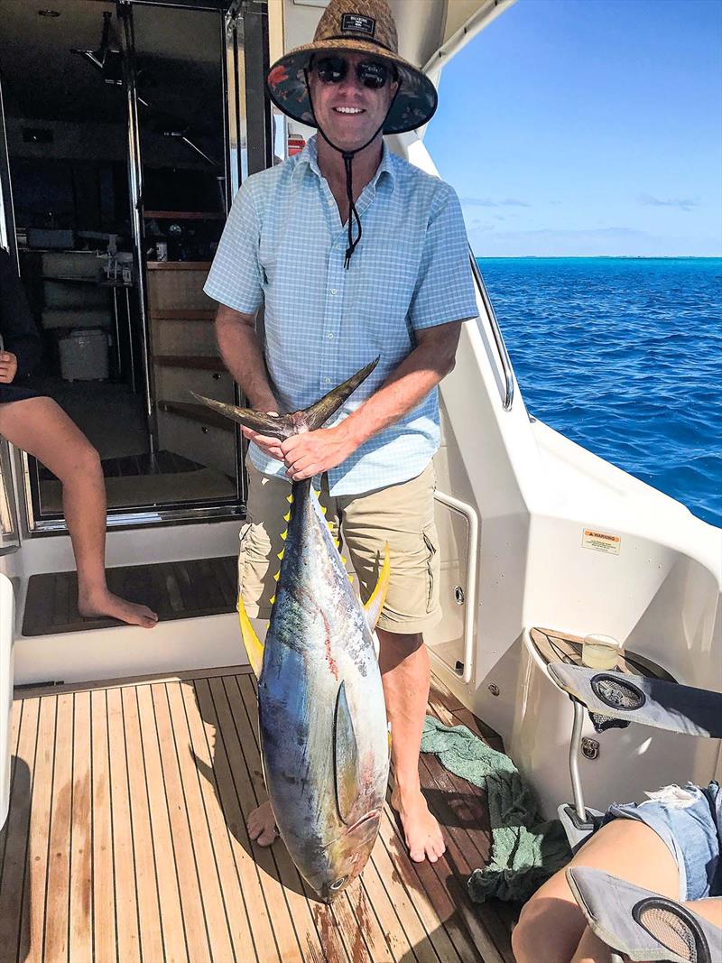 Andrew Luxton with a tuna caught by the Legend III team - photo © Riviera Australia