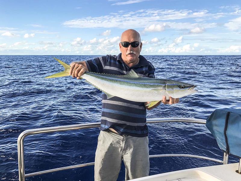 Mark Slocombe displays another winning catch - photo © Riviera Australia