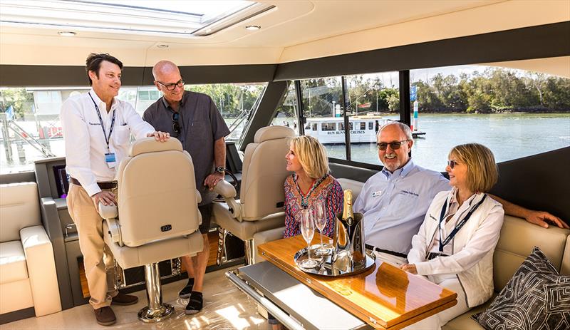 Prospective boat buyers Jeff and Robin Lyall from Orange City in California, made the trip from the USA to the Gold Coast to view a Maritimo M59 cruising motor yacht. They are show with Maritimo CEO Garth Corbitt and dealer partners Bill and Michelle King photo copyright Darren Gill taken at  and featuring the Power boat class