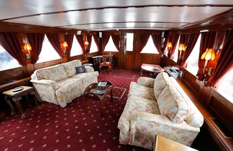 The salon on the former presidential yacht, Honey Fitz, is seen as it is docked in West Palm Beach, Florida - photo © Reuters