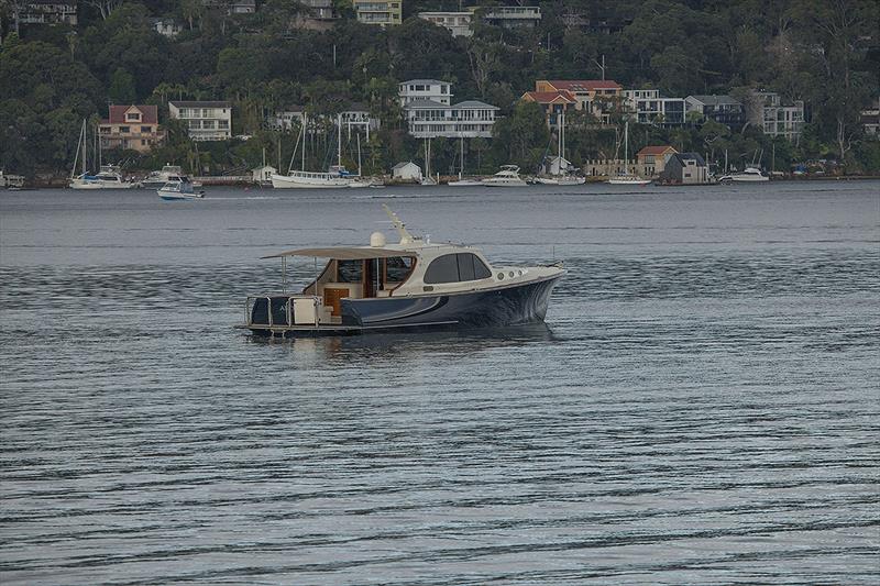 Despite the rain, this Palm Beach owner was enjoying the tranquility of Pittwater photo copyright John Curnow taken at  and featuring the Power boat class