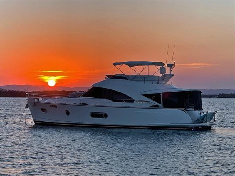 A beautiful sunset adds to the magic aboard the beautiful Belize 52 Daybridge Aqua Bella photo copyright Riviera Australia taken at  and featuring the Power boat class