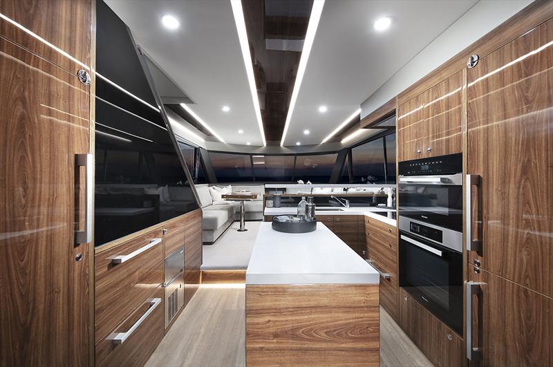 Pantry to the left and fridge to the right, with the great new backward facing stairs behind the black panel - New Maritimo M55 photo copyright Maritimo taken at  and featuring the Power boat class