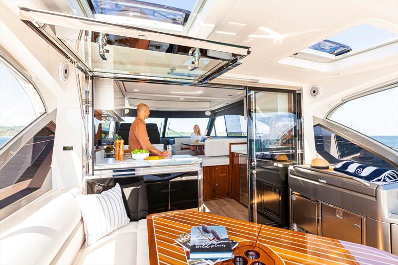 The airy 4600 Sport Yacht Platinum Edition saloon flows to the entertainer's cockpit through a sliding glass door and awning window photo copyright Riviera Australia taken at  and featuring the Power boat class