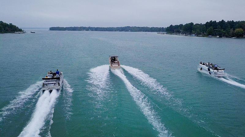 Elk Rapids - Michigan E-Marine Event - Test Rides of the Vita Seal and X Shore Eelex 8000 with the electric hydro dam in the background - photo © Aqua SuperPower