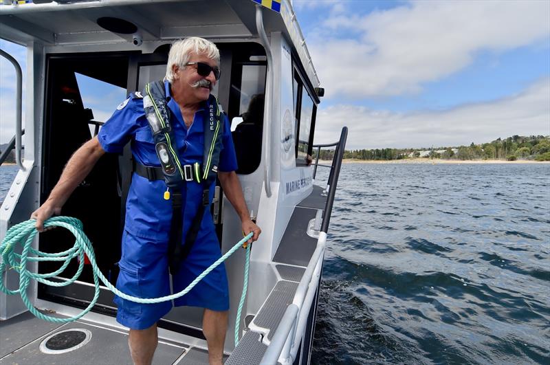 Marine Rescue Alpine Lakes volunteer Adolf Franco is shown the ropes on the new vessel - photo © Marine Rescue NSW