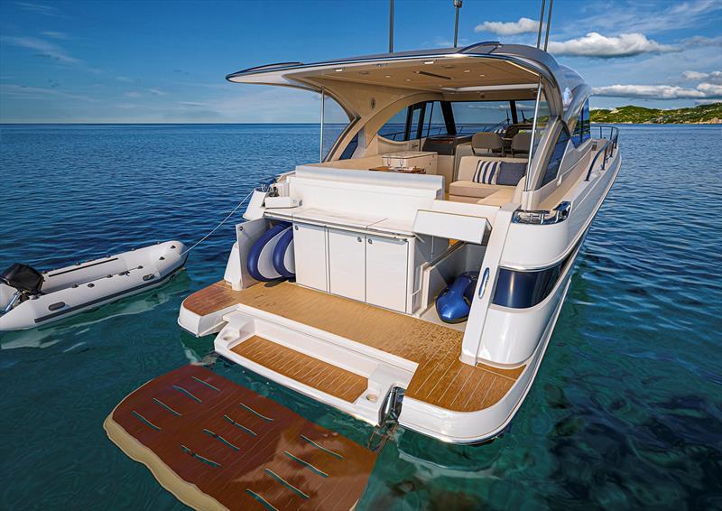 Integrated transom storage for equipment and toys - photo © Riviera Australia