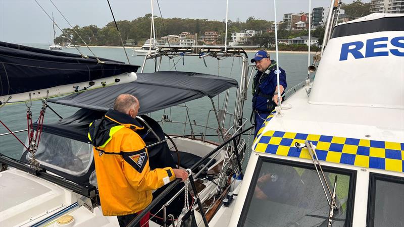 Port Stephens crew member with rescued sailor - photo © Marine Rescue NSW 