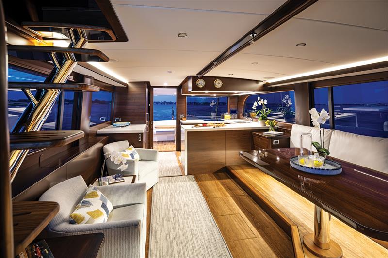 Large opening side and aft windows bathe the salon and aft galley in natural light, and ventilation - photo © Grand Banks Yachts