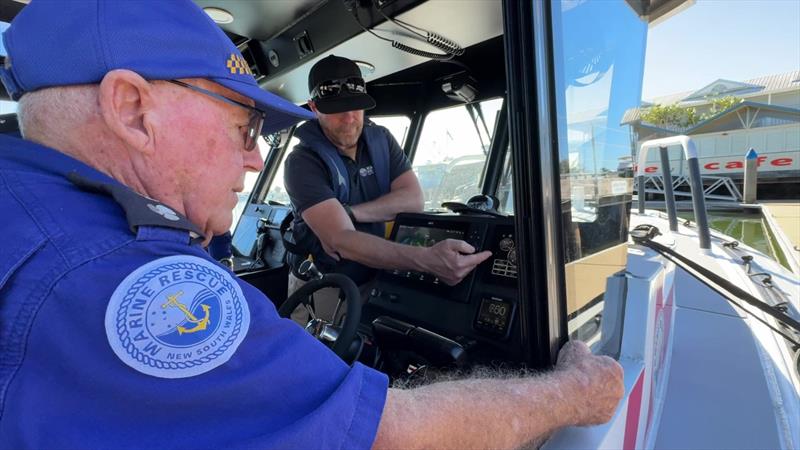 Marine Rescue Trial Bay Unit Commander Ian Turner is shown the ropes on the new TB30 - photo © Marine Rescue NSW