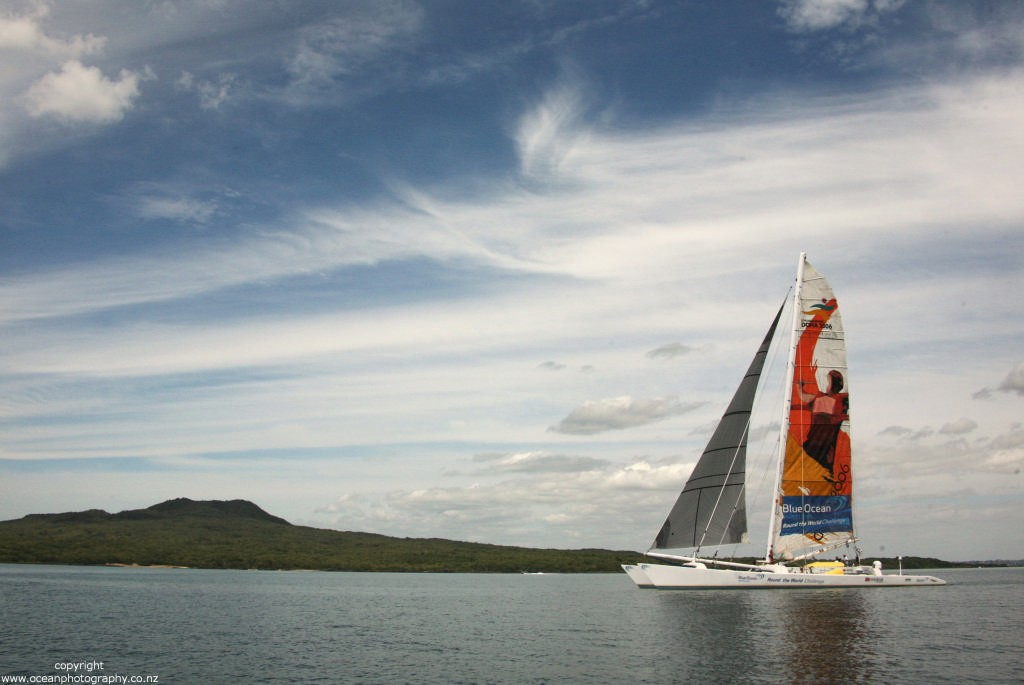 Day 3 Tornado Worlds Tony Bullimore&rsquo;s giant Cat  motors up the harbour. Sails up but no wind. photo copyright  Will Calver - Ocean Photography http://www.oceanphotography.co.nz/ taken at  and featuring the  class