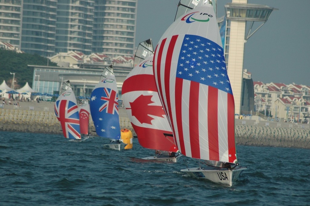 Nick Scandone and Maureen Mckinnon-Tucker on their way to winning a Gold medal in Qingdao - photo © Lynn Fitzpatrick