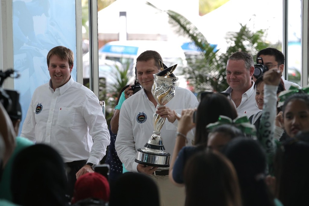 L-R Craig Mitchell, Tour Director, James Pleasance, Executive Director arrive with the AWMRT Trophy - photo ©  Miyeera Navaretna