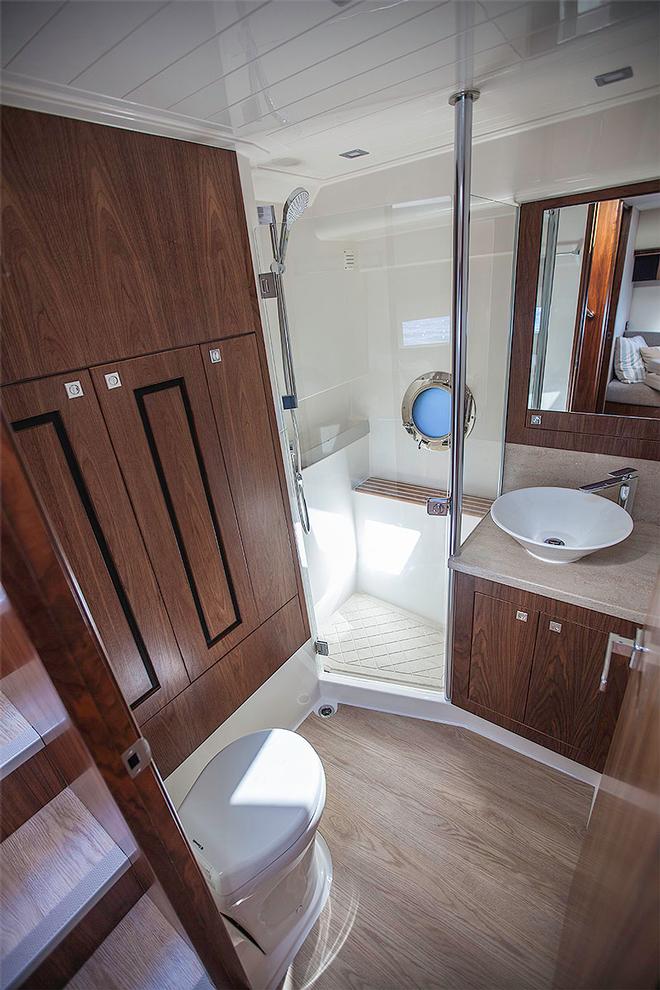 Day or second head has the washer/dryer in behind the locker on the left. - Riviera 4800 Sport Yacht ©  John Curnow