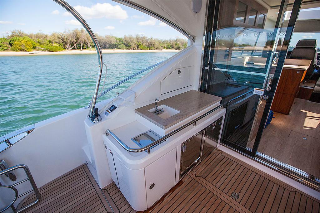 Aft joystick controller next to the fridge and icemaker under the prep bench. - Riviera 4800 Sport Yacht ©  John Curnow