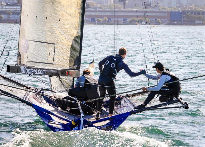 Fang Warren congratulates skipper Micah Lane on Yandoo's victory in the 18ft Skiff Winnings 2024 JJ Giltinan Championship photo copyright SailMedia taken at Australian 18 Footers League and featuring the 18ft Skiff class