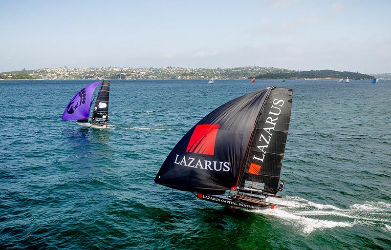 Race for the lead on Day 5 in a southerly breeze during the Winnings JJ Giltinan Championship photo copyright SailMedia taken at Australian 18 Footers League and featuring the 18ft Skiff class