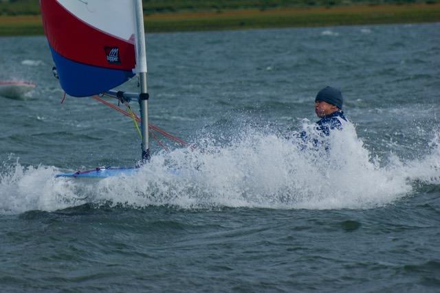 ITCA East Region Topper Travellers at Brancaster Staithe - 'solo sailor in spray' photo copyright John Blackman Northwood taken at Brancaster Staithe Sailing Club and featuring the Topper class