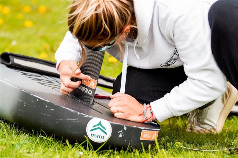 Riders putt event limitation stickers on chosen equipment - Ensis Engadinwing 2024 Formula Wing Europeans day 1 - photo © IWSA Media / Sailing Energy